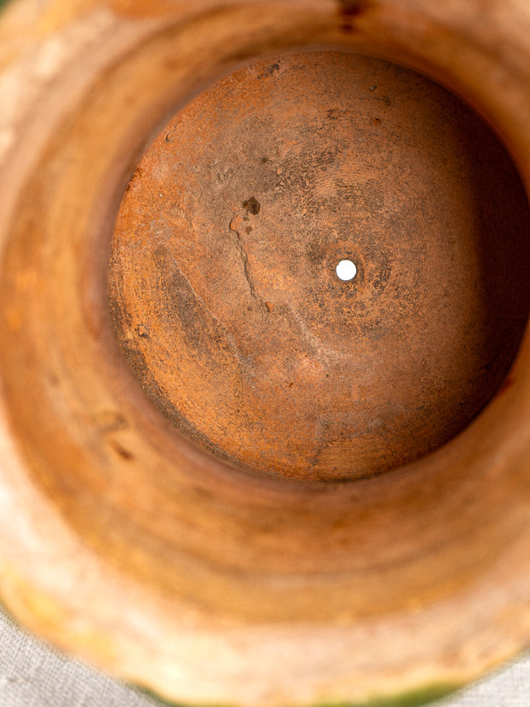 Inside of antique French green glazed terracotta vase with central drainage hole, hand-thrown, c. 1900.