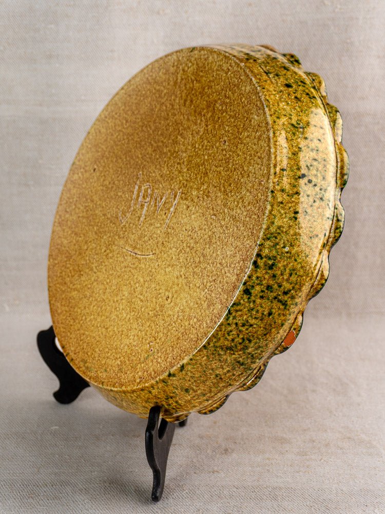 Vintage French JANY Studio earthenware tarte dish with textured mustard yellow and green glaze, artist-signed base.