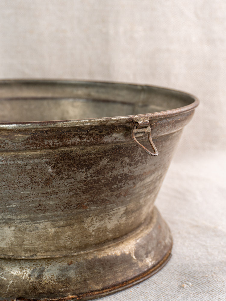 Antique French passoire, tinned sheet iron strainer with pierced rosette base and rim handle.
