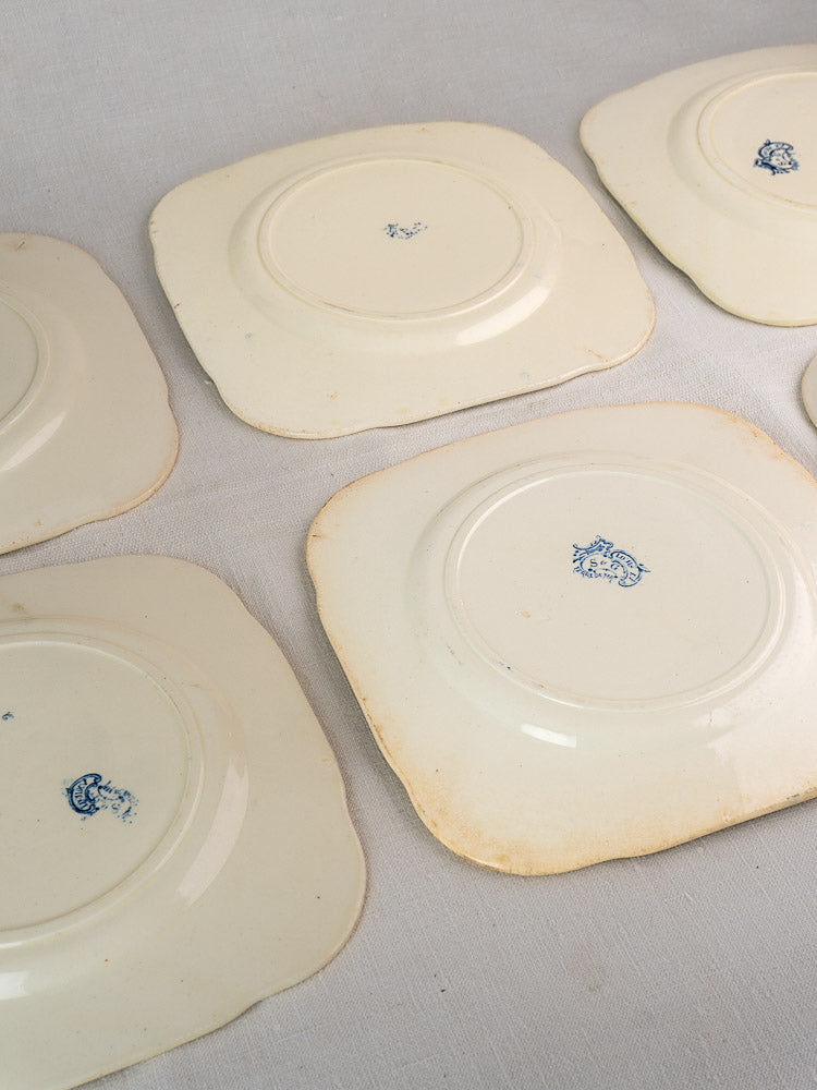 Set of ten antique French Clairefontaine Louis XV Terre de Fer plates, c. 1885, with blue maker’s marks and patina.
