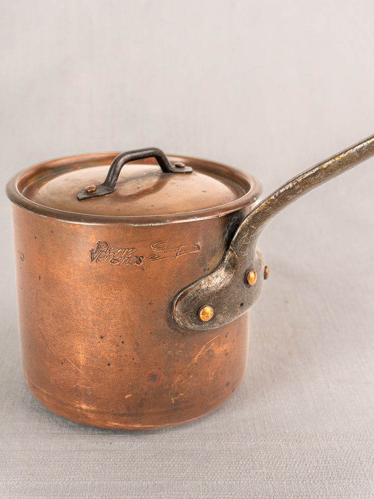 Antique French copper saucepan by Pierre Vergnes Durfort with lid, long weathered handle, and vintage patina.