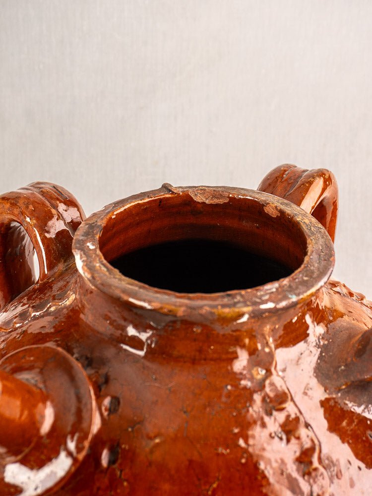 Antique French Périgord walnut oil jug, 19th century, glossy brown ceramic with aged patina.
