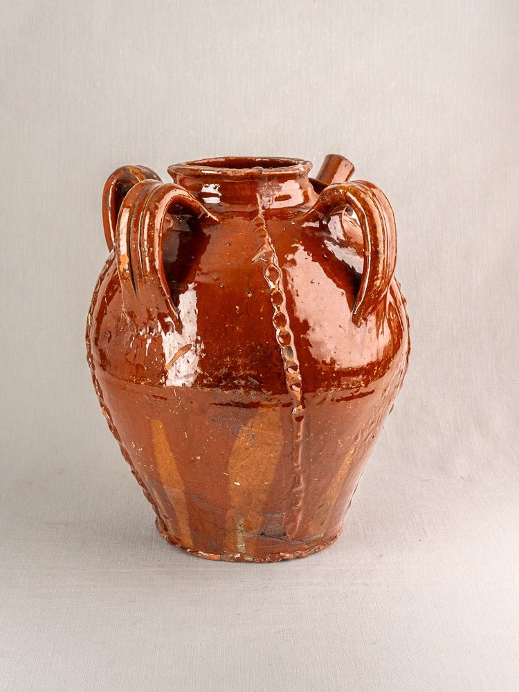 Large glossy brown French ceramic jug with zigzag relief, dual handles, 19th-century Périgord earthenware.