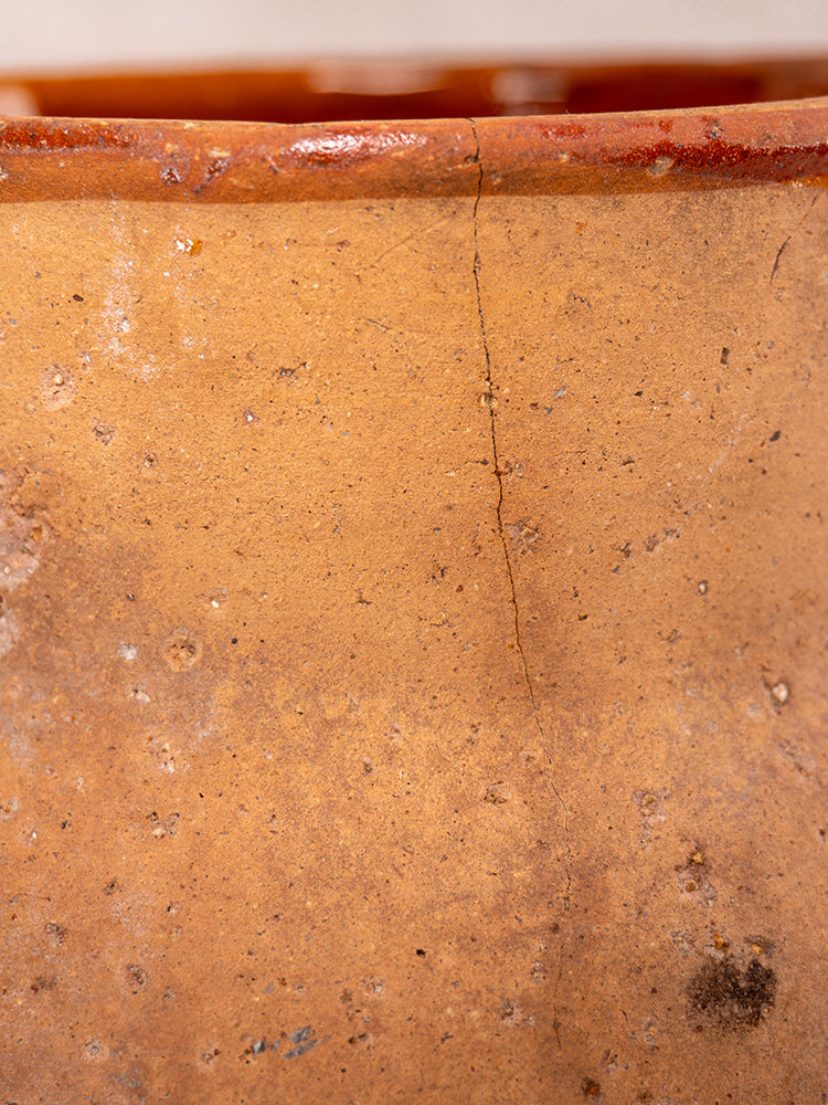 Vallauris Pot à Lait in glazed terracotta, Societe Generale stamped, with a hairline crack and Provençal ceramic texture.