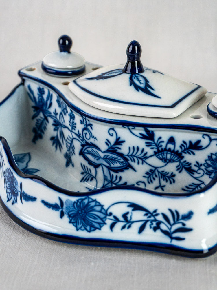 Blue and white ironstone encrier with Blue Onion pattern, two lidded containers on attached tray.