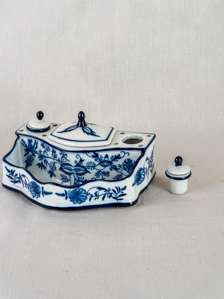 Blue and white ironstone inkstand with Blue Onion floral pattern, two lidded containers, central compartment.