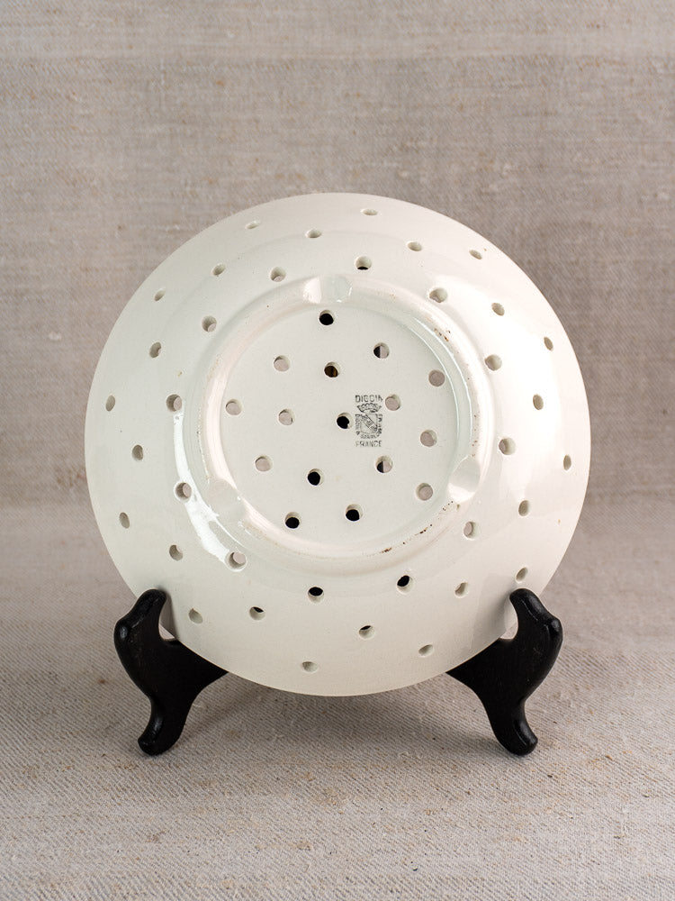 Antique French Digoin Sarreguemines berry strainer upside down, white stoneware, maker’s mark visible, black stand.