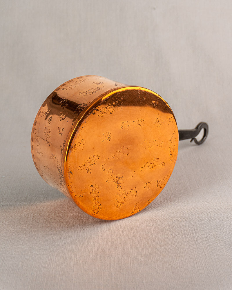 Hammered copper pot from Jean Goardère vintage French set, black metal handle with hanging loop.