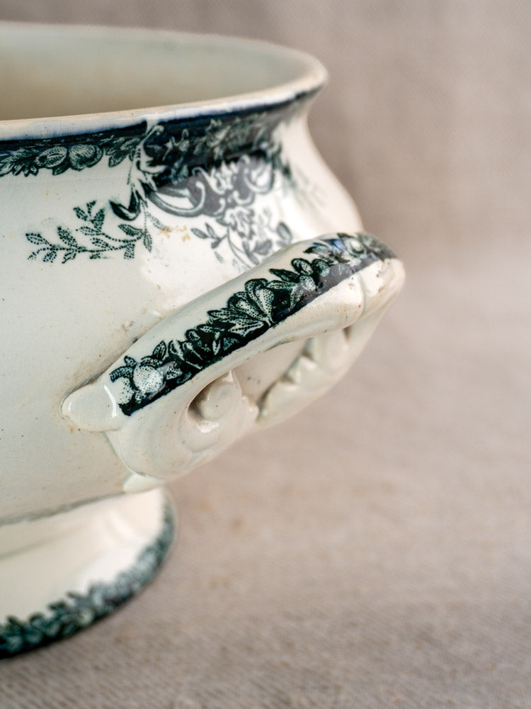 Antique French Saint-Amand soupière, circa 1900, black faience with fruit pattern and ornate handle.