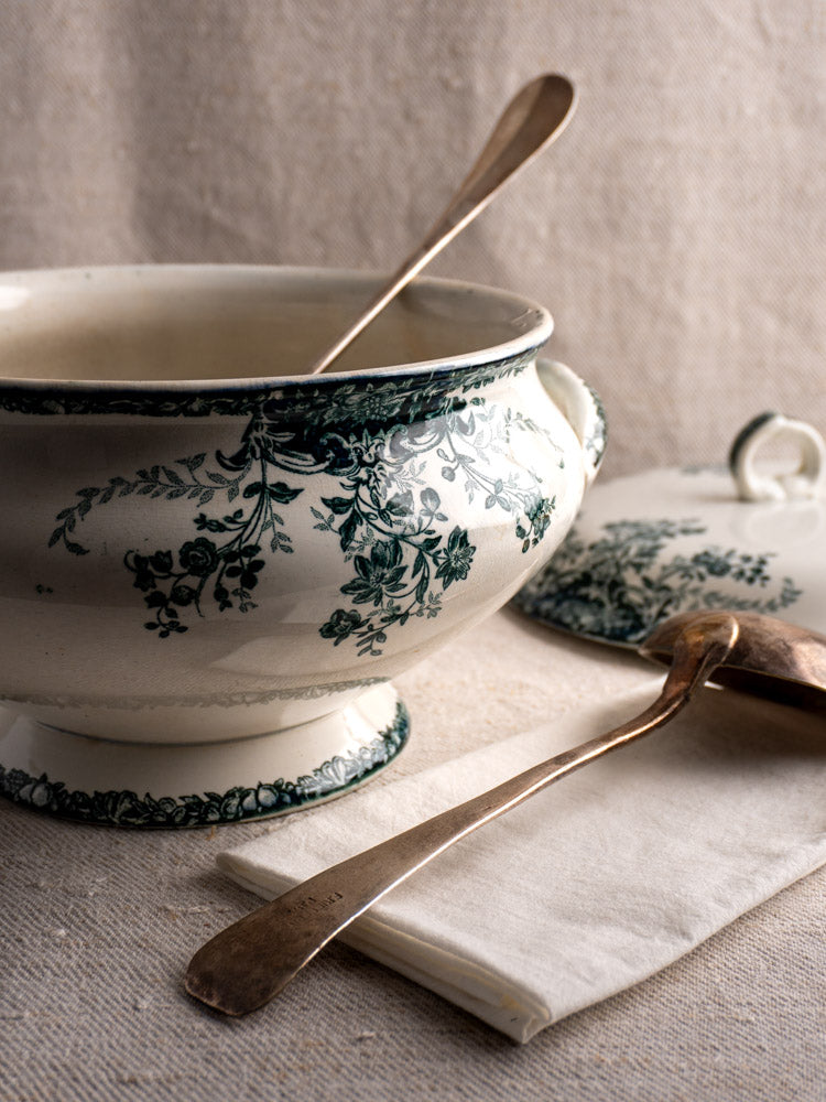 Antique French Saint-Amand faience soupière with matching lid and serving spoon on cloth napkin.