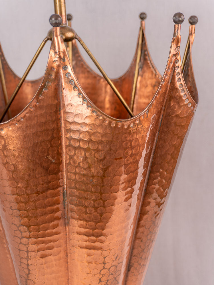 Vintage French umbrella stand in hammered copper and brass with ball-tipped spokes and mid-century design.