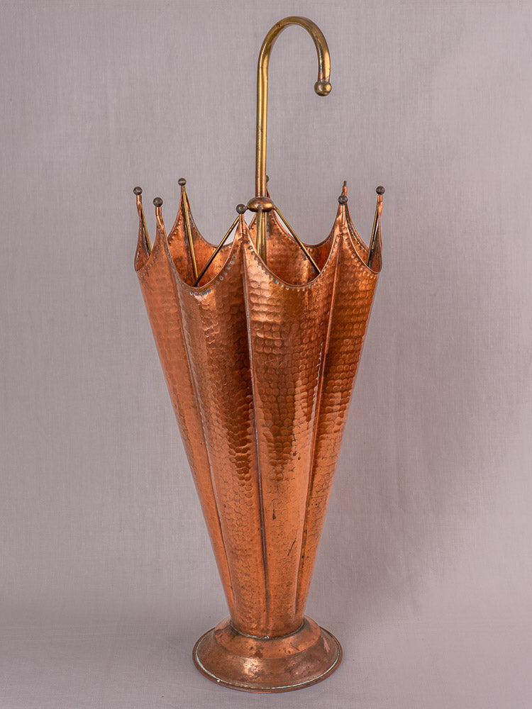 Vintage French umbrella stand in hammered copper and brass, open umbrella shape with curved handle.