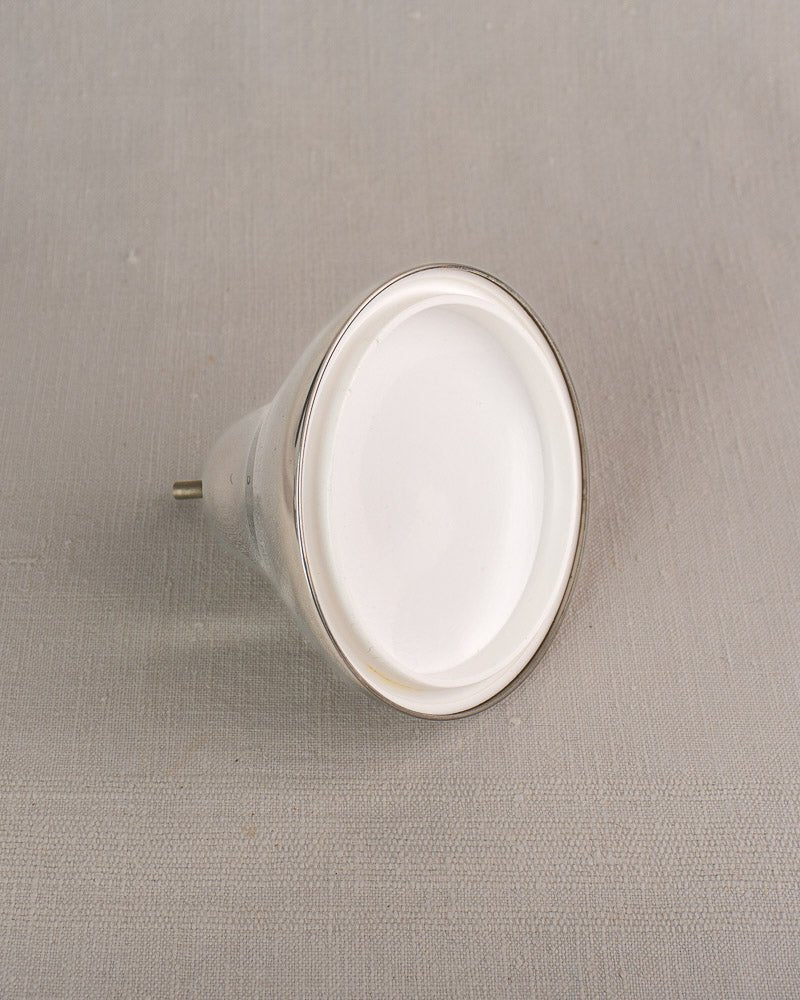 Vintage French Pear Ice Bucket in stainless steel, 1960s barware, on light gray textured surface.