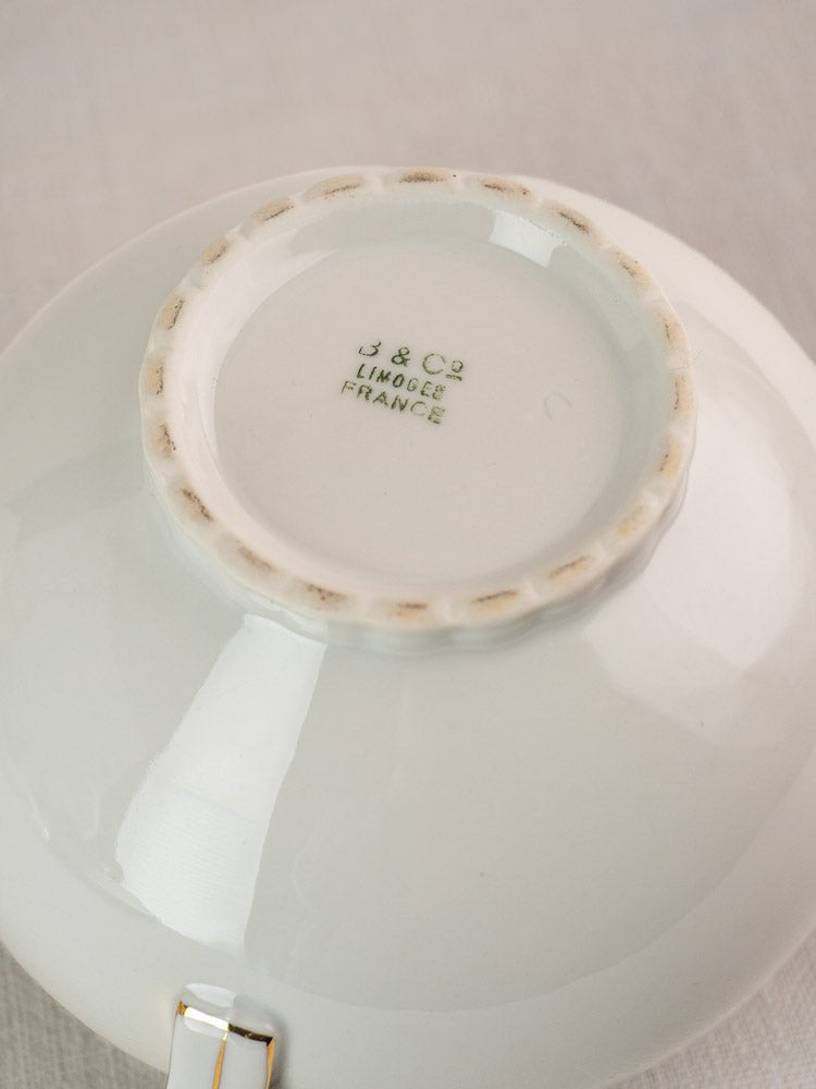 Underside of antique Bernardaud Limoges white porcelain dish, green J & Cie Limoges France stamp.