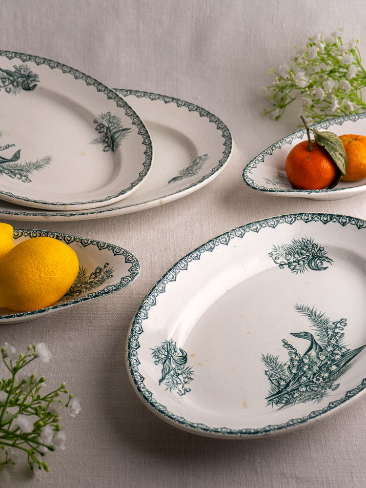 Set of five antique French Saint Amand Muguet faience platters with citrus and white blossoms.