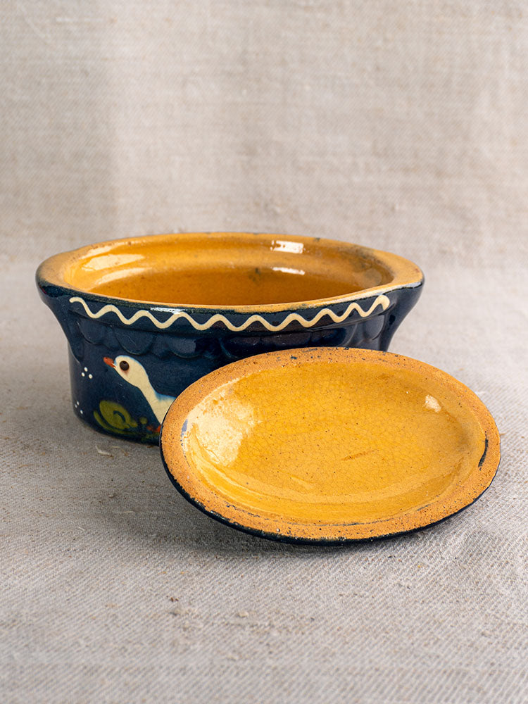 Cobalt blue antique French Soufflenheim covered terrine with duck motif and wavy white rim on neutral fabric. Mid 20th century.