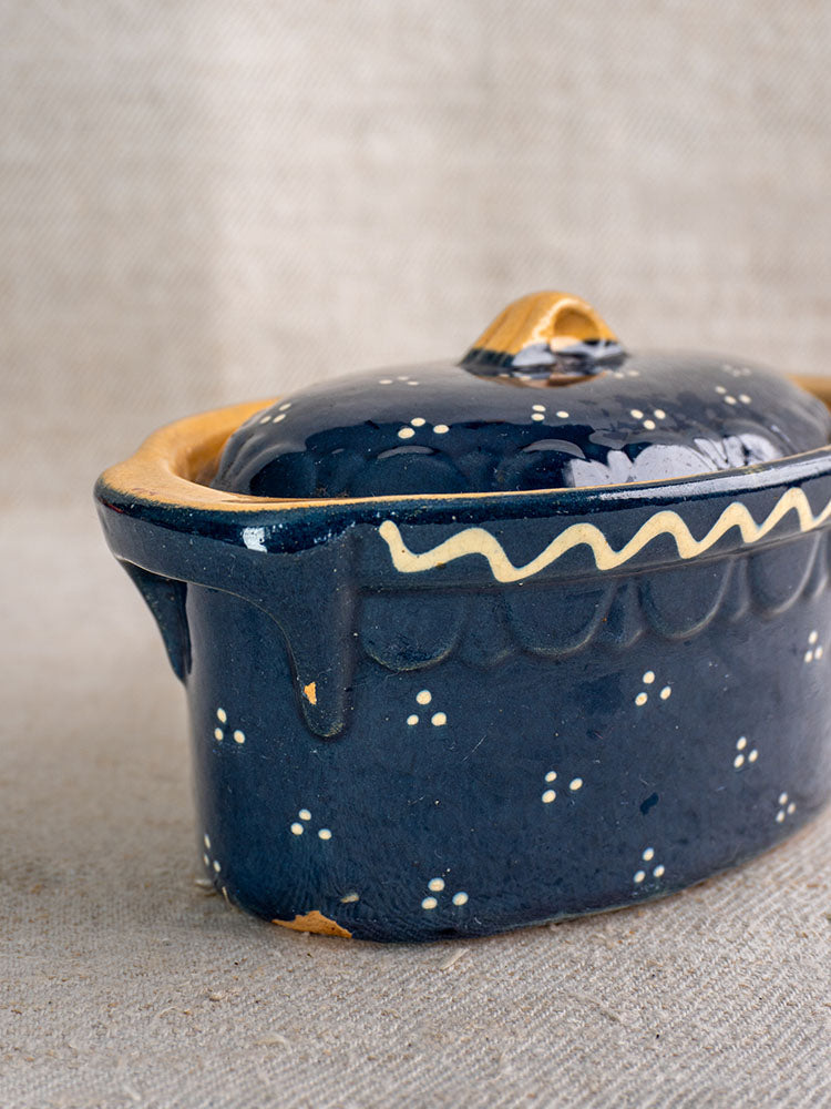 Antique French Soufflenheim covered terrine with cobalt blue glaze and duck motif, minor edge chips, on textured fabric.