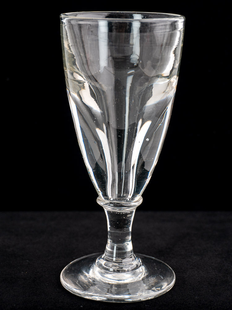 Set of 4 antique French uranium absinthe glasses, hand blown with flared bowls, on black background. Late 19th century Ouraline glass.