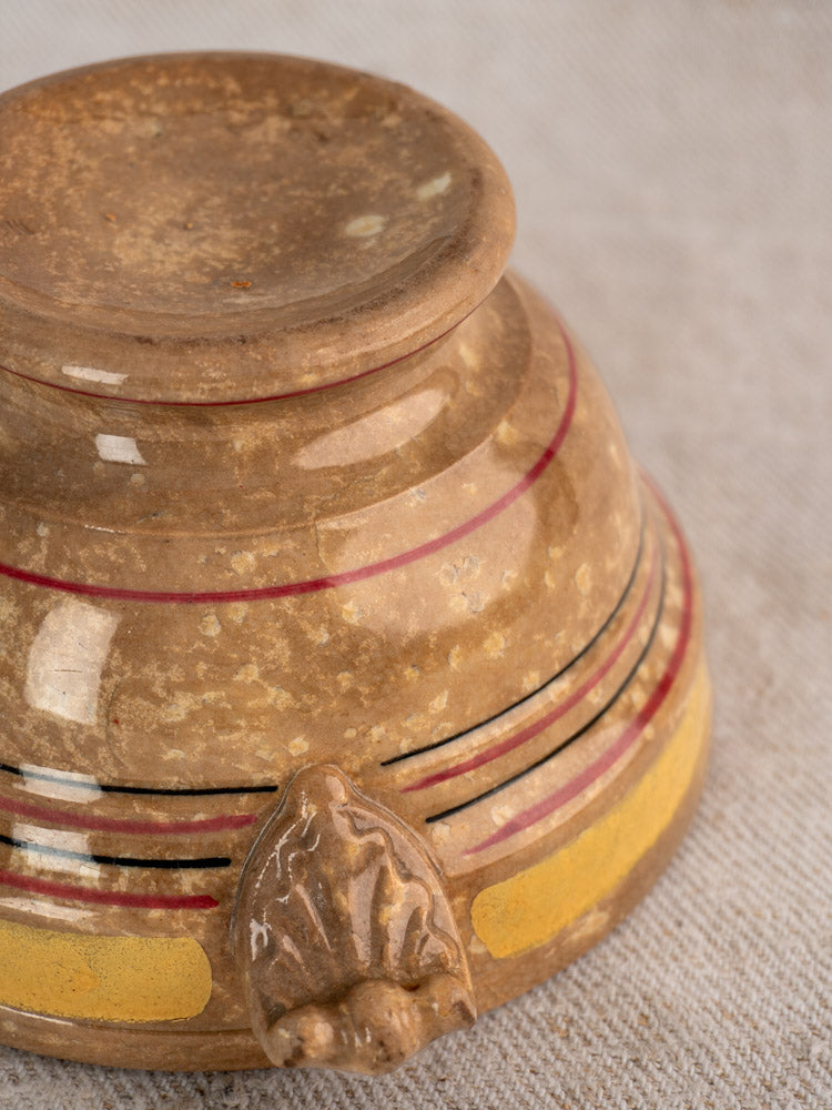 Upside-down antique French faience bowl, HB et Cie Choisy-le-Roi, textured base, red, black, yellow stripes, beige foot detail.