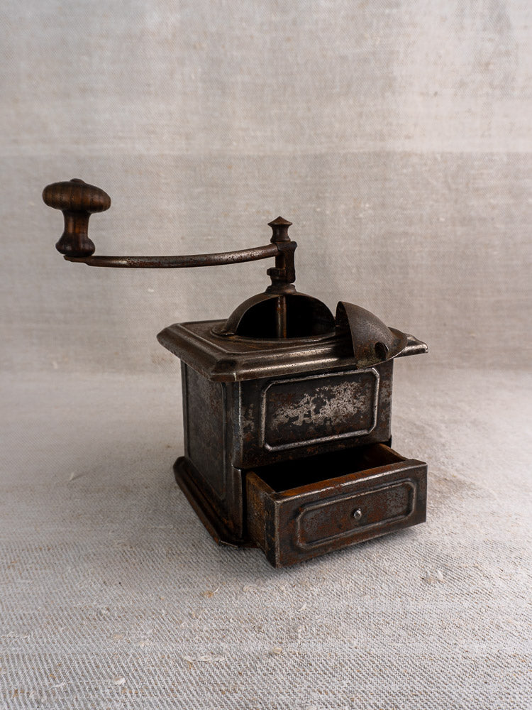 Antique French Peugeot Frères tinned steel coffee mill with side handle and open front drawer.