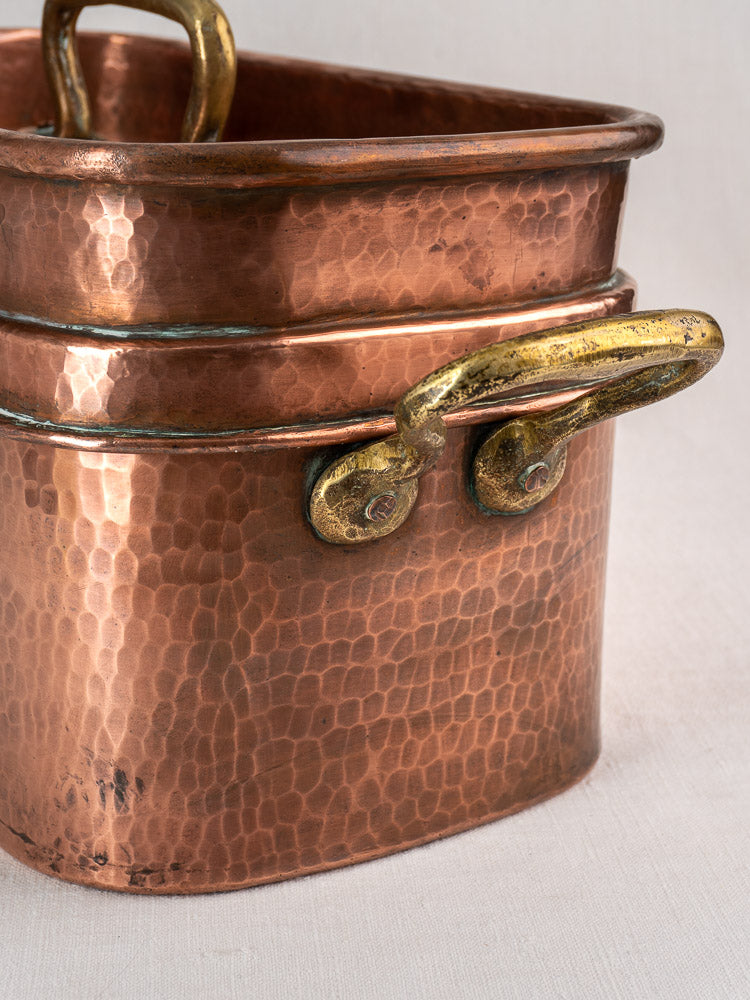 Antique French copper daubière, 19th-century hand-hammered rectangular pan with riveted brass handles and textured surface.