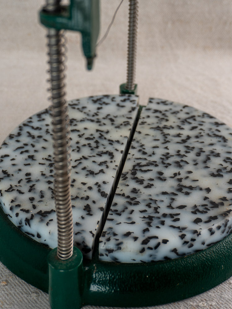 Vintage French Roquefort cheese cutter by Maria Grimal, 1960s, with green base and metal rods on neutral background.