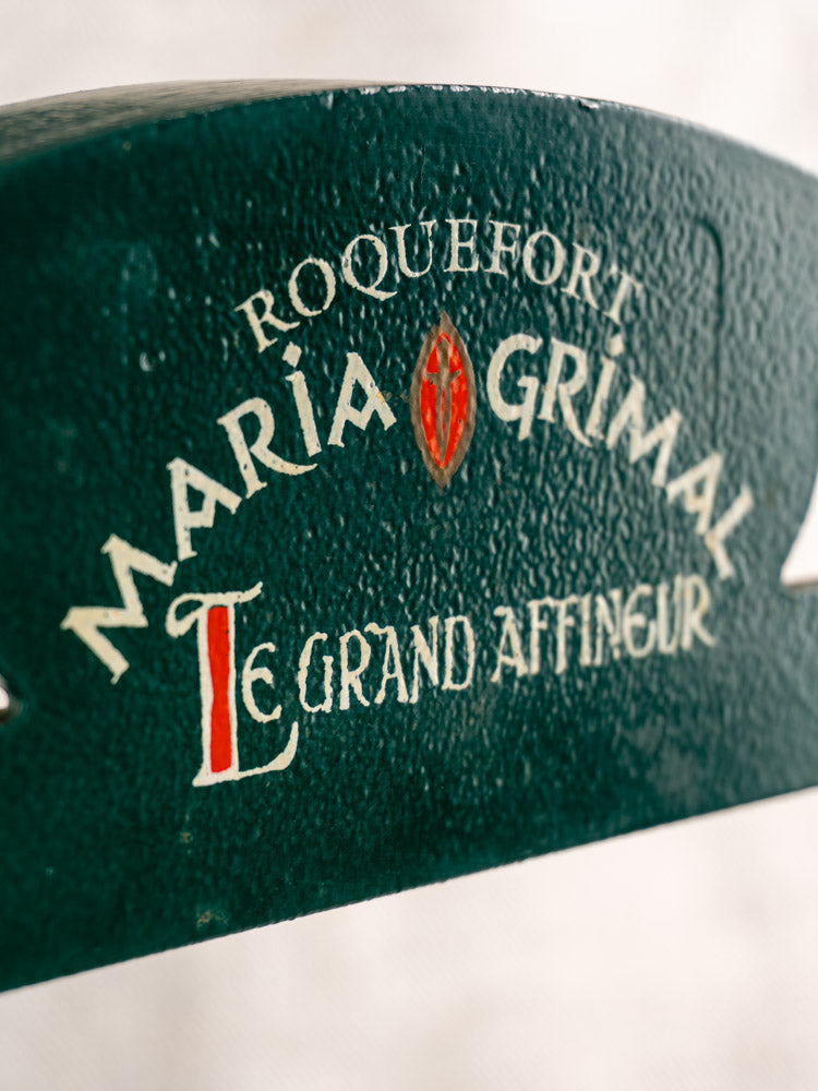 Vintage French Roquefort cheese cutter, textured green surface, white and red text, Maria Grimal Fromagerie, 1960s.