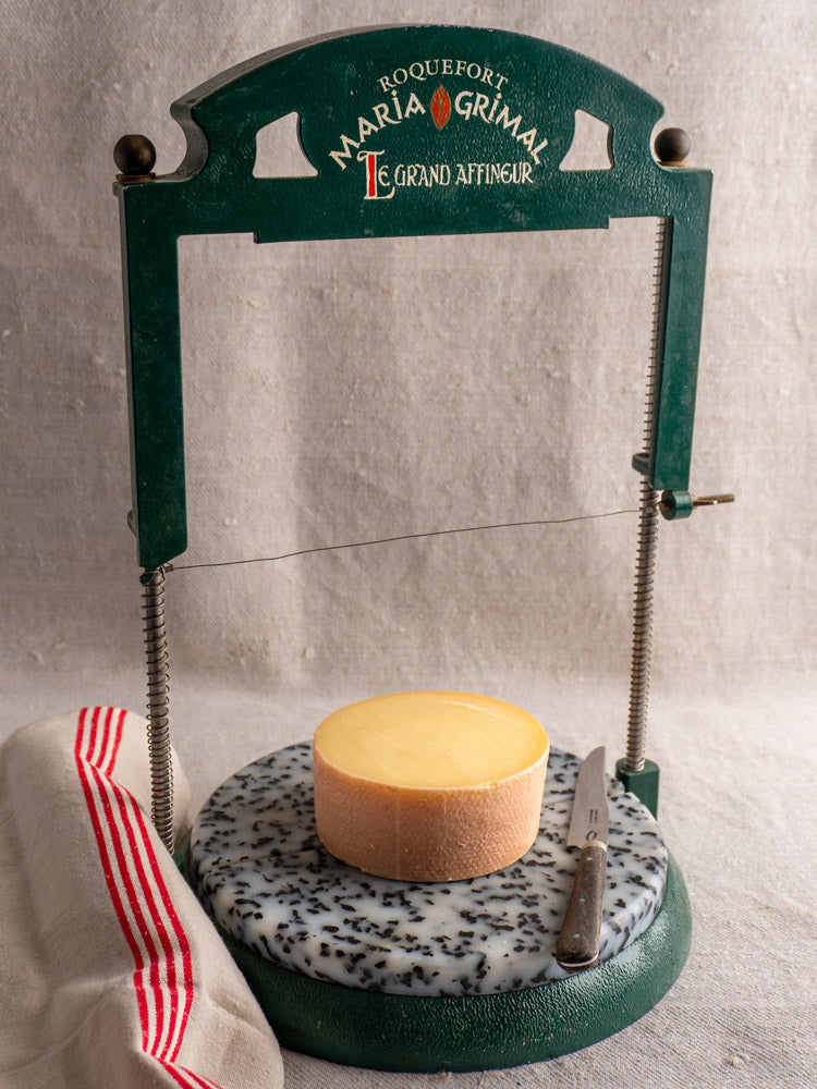 Vintage French Roquefort cheese cutter by Maria Grimal, 1960s, green finish with circular base and blue cheese wedge.